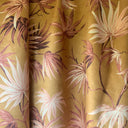Fabric rolls with pink floral designs on a yellow background, reminiscent of pink wallpaper and tropic wallpaper.